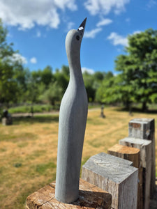 reaching for the sky, beeldhouwwerk vogel in steen, julius murenza