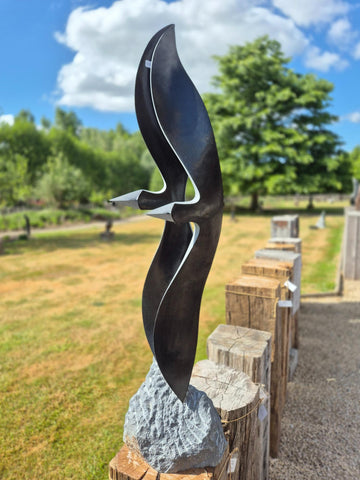 tuinbeeld vogels, julius murenza, springstone, beelden in steen, wereldbeeld beeldentuin