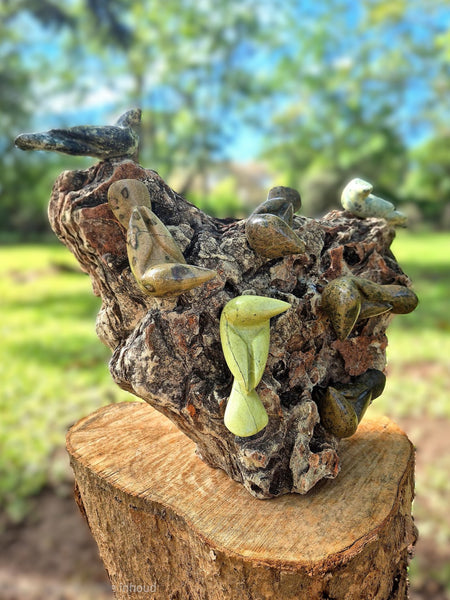 chattering birds in stone on a rock, unique piece of art