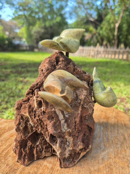sculpture birds on a rock