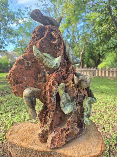 stone birds sitting on a rock, shona art zimbabwe, cute and happy statue
