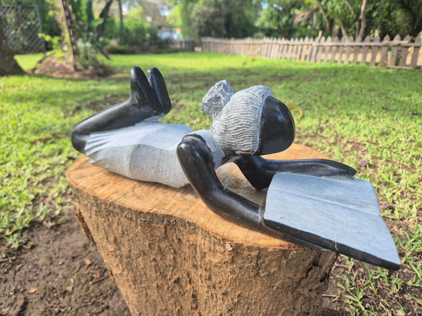 reading a book, stone sculpture, shona art