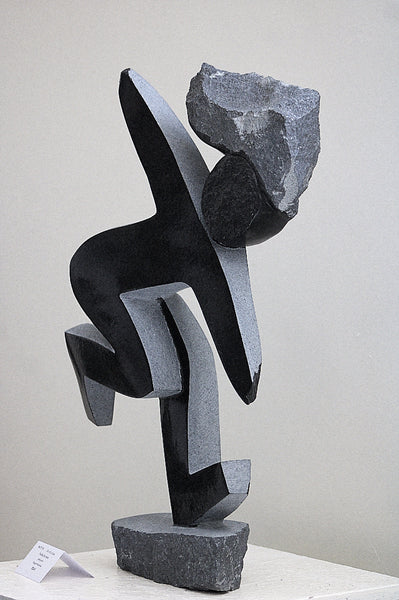 dancing figure in stone