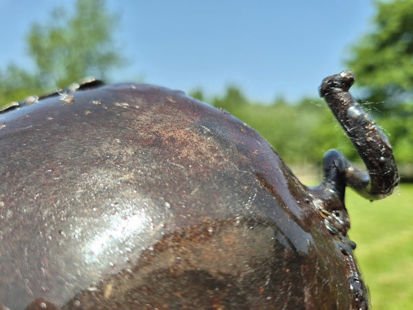 metal piglet, made from oil drums, close up tail