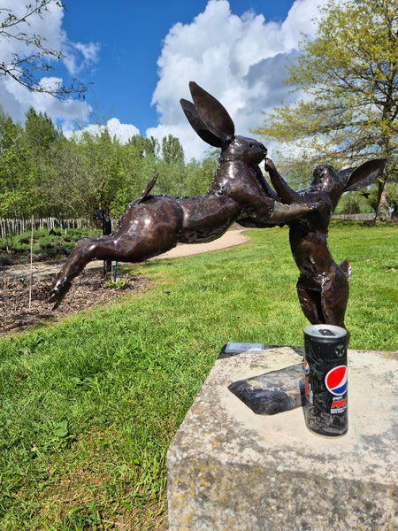 jumping hares, couple of hares, metal sculpture, zimbabwe handcrafted, wereldbeeld belgium, worldwide shipping.