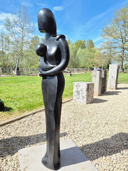 stone sculpture couple with baby